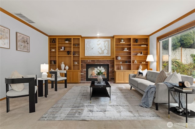 living room featuring crown molding, light carpet, built in features, a brick fireplace, and visible vents