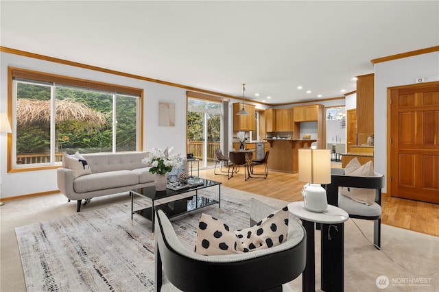 living area featuring light wood-style flooring, crown molding, recessed lighting, and baseboards