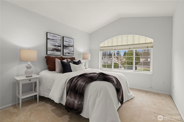 bedroom featuring baseboards, carpet floors, and lofted ceiling