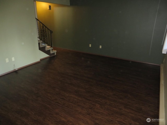 basement featuring dark hardwood / wood-style flooring