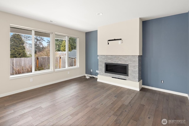 unfurnished living room with dark hardwood / wood-style flooring