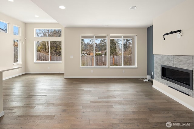 unfurnished living room featuring dark wood-type flooring