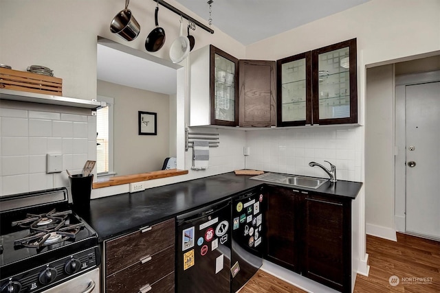 kitchen featuring sink, dark hardwood / wood-style floors, dark brown cabinetry, tasteful backsplash, and gas stove