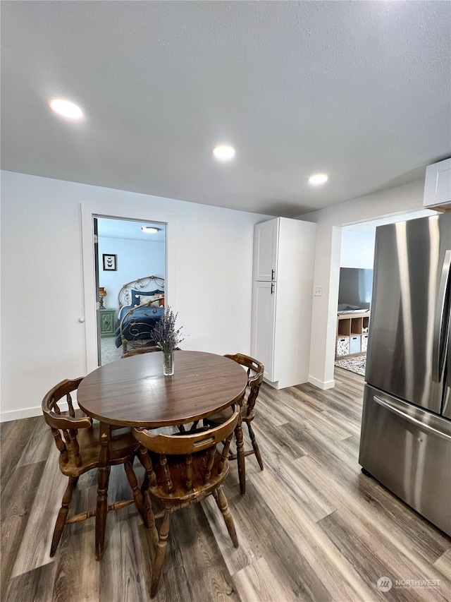 dining space featuring light hardwood / wood-style flooring