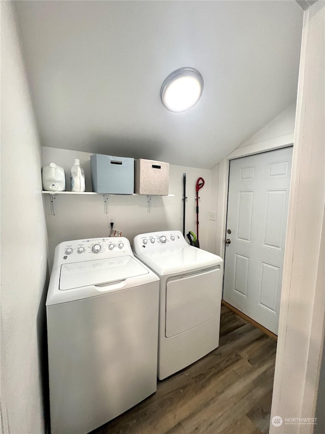 laundry room with dark hardwood / wood-style flooring and washer and dryer