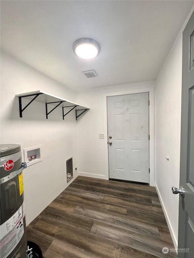 clothes washing area with dark hardwood / wood-style flooring, hookup for a washing machine, and water heater