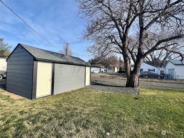 view of outdoor structure featuring a lawn