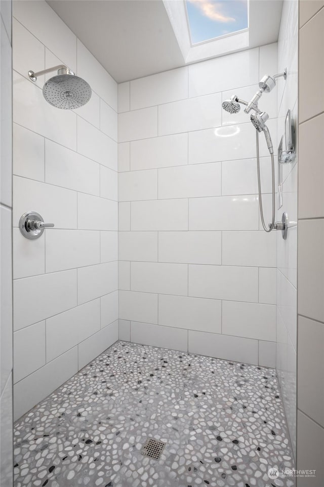 bathroom with a tile shower