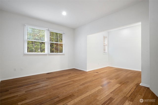 empty room with light hardwood / wood-style floors