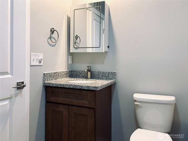 half bath with toilet and vanity