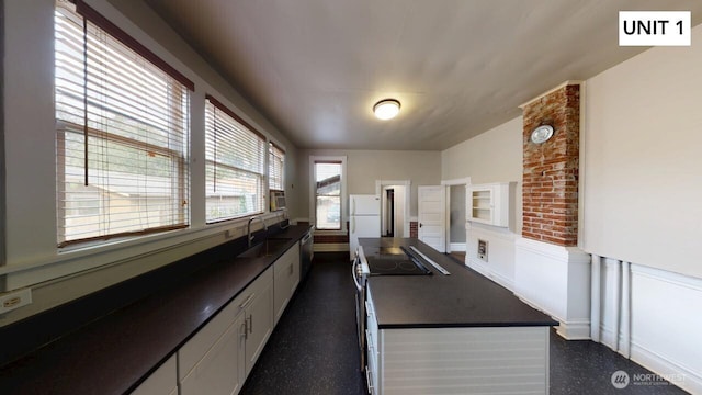 kitchen featuring white cabinetry, sink, and appliances with stainless steel finishes