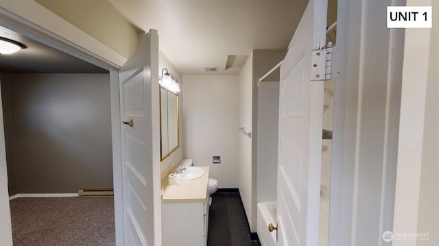 bathroom featuring vanity, toilet, and a baseboard heating unit