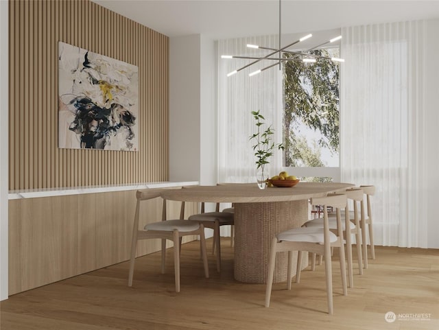 dining area featuring a chandelier and wood finished floors