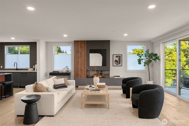 238 4th Ave Unit 100, Kirkland, WA 98033 - living room featuring recessed lighting, light wood finished floors, and healthy amount of natural light