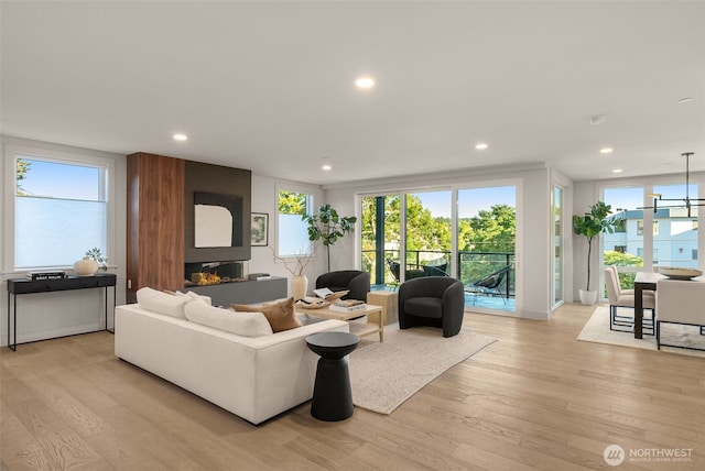 238 4th Ave Unit 100, Kirkland, WA 98033 - living area with light wood-type flooring, recessed lighting, and healthy amount of natural light