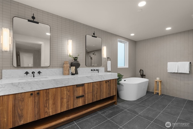 238 4th Ave Unit 100, Kirkland, WA 98033 - full bath featuring tile walls, double vanity, tile patterned flooring, and a freestanding tub