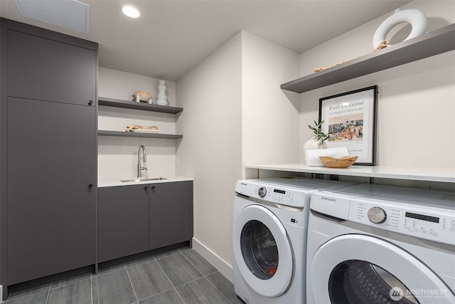 238 4th Ave Unit 100, Kirkland, WA 98033 - laundry room with washing machine and clothes dryer, bar with sink, cabinet space, and recessed lighting
