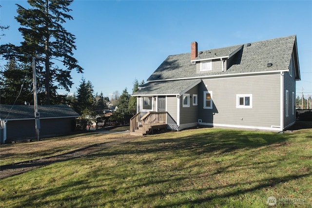 back of house featuring a lawn