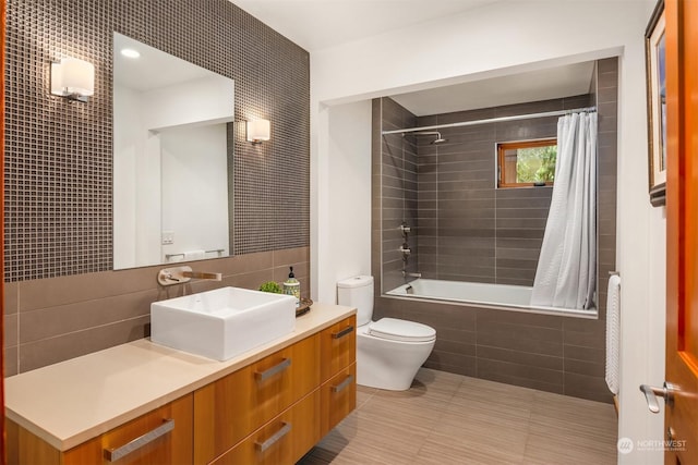 full bathroom featuring shower / bathtub combination with curtain, tile walls, backsplash, vanity, and toilet