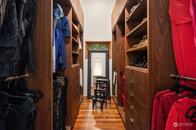 walk in closet featuring light hardwood / wood-style flooring