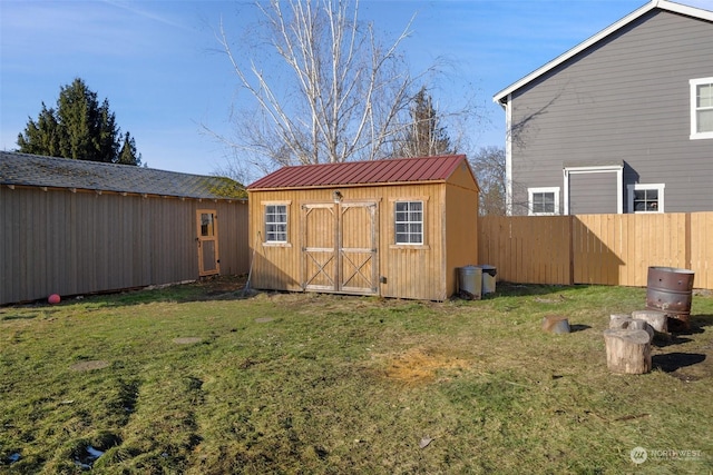 view of shed featuring fence