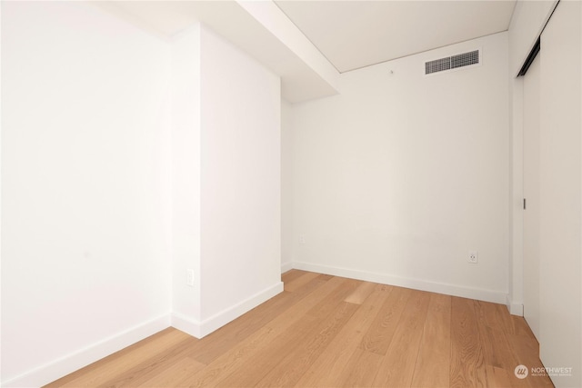 spare room featuring light hardwood / wood-style flooring