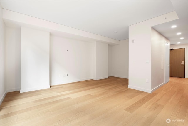 spare room featuring light hardwood / wood-style floors