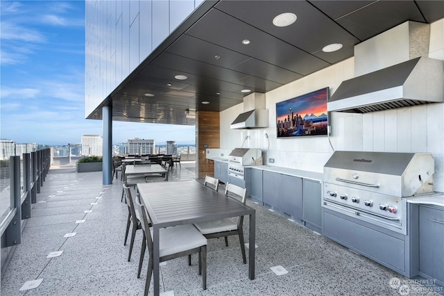 view of patio featuring area for grilling and a grill