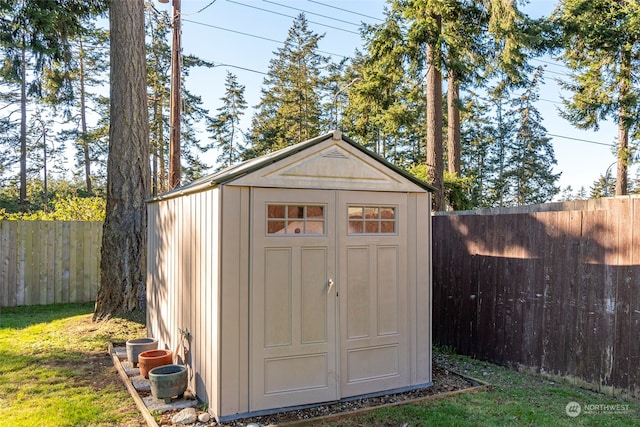 view of shed featuring a fenced backyard