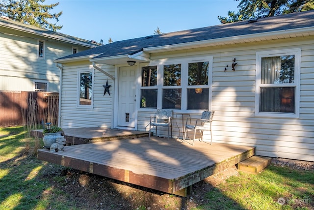 wooden terrace featuring fence