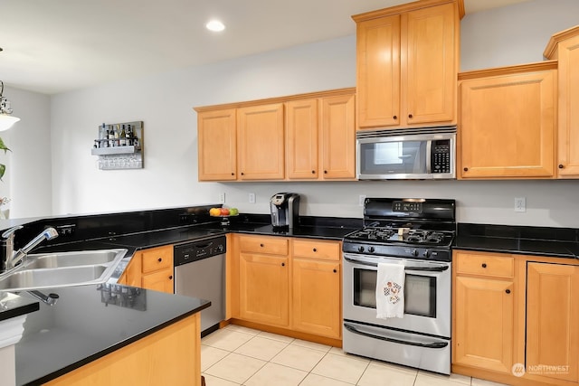 kitchen with sink, light tile patterned floors, stainless steel appliances, decorative light fixtures, and kitchen peninsula