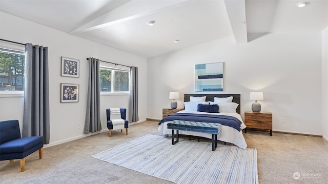 carpeted bedroom with vaulted ceiling with beams