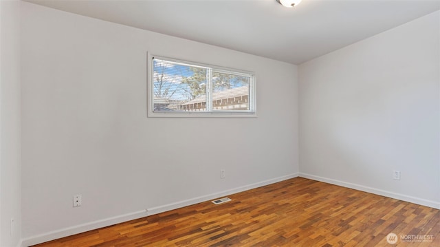 27223 154th Ave SE, Kent, WA 98042 - empty room featuring baseboards and wood finished floors