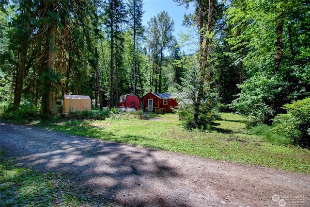 exterior space featuring a shed