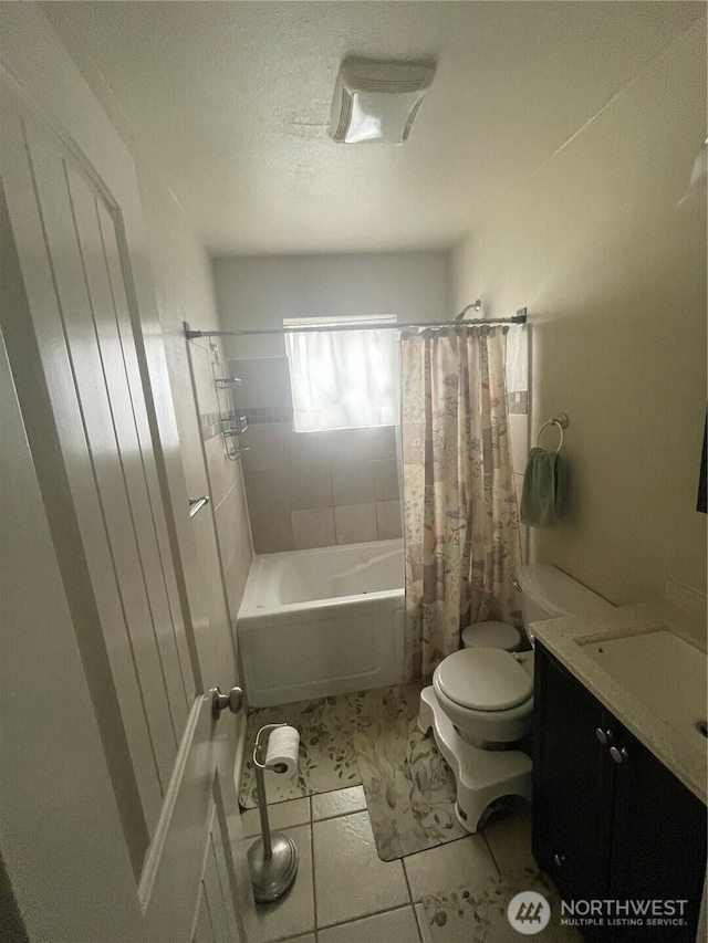 bathroom with toilet, shower / tub combo, a textured ceiling, and vanity