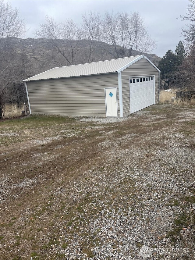 detached garage featuring a mountain view