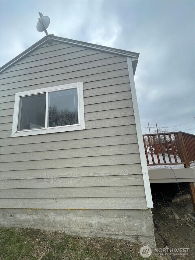 view of property exterior featuring a deck