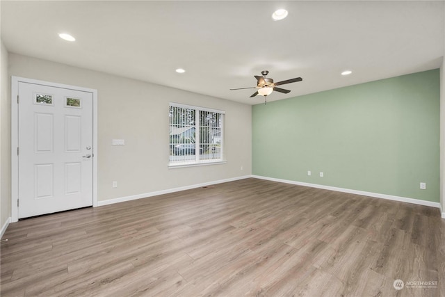 interior space with ceiling fan and light hardwood / wood-style floors