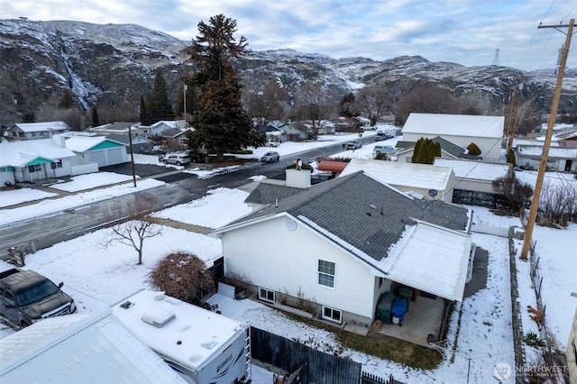 snowy aerial view featuring a mountain view