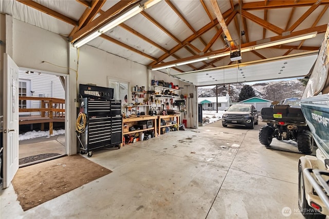 garage featuring a workshop area and a garage door opener