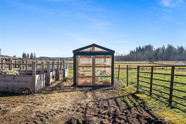 view of outdoor structure with a rural view