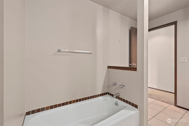 bathroom featuring tile patterned floors and a bathing tub