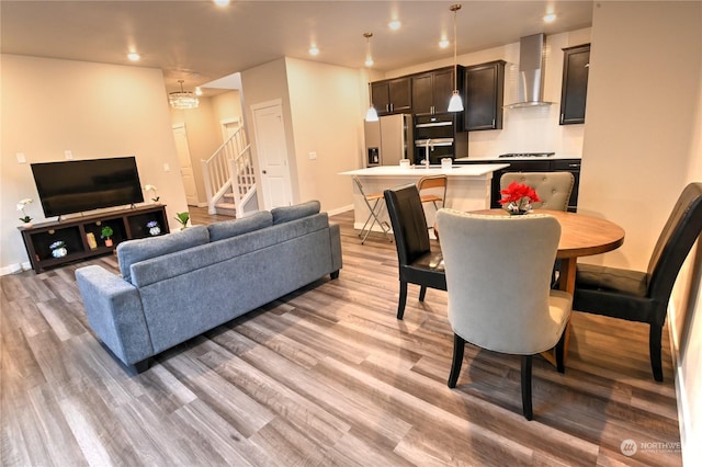 living room featuring sink and light wood-type flooring