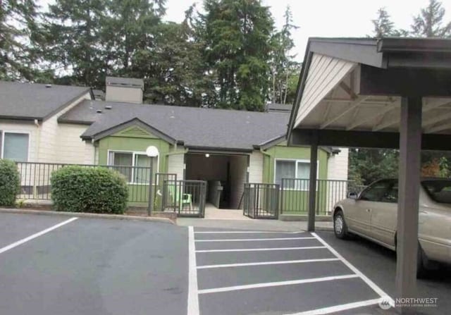 view of parking featuring a carport