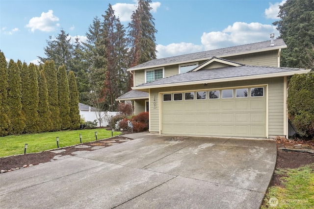 view of front facade featuring a front yard and a garage