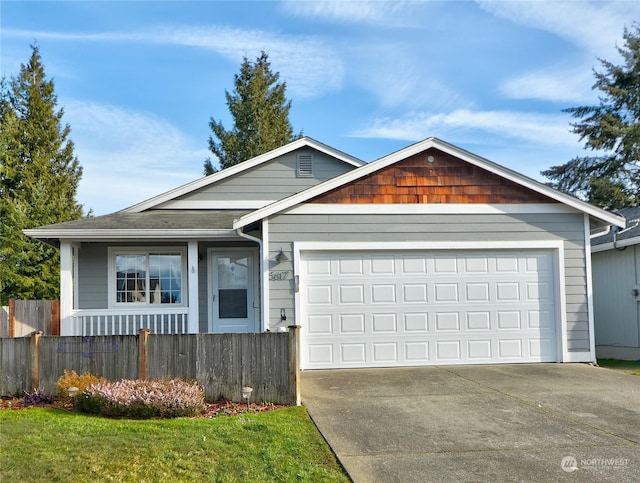 ranch-style home with a garage and a front yard