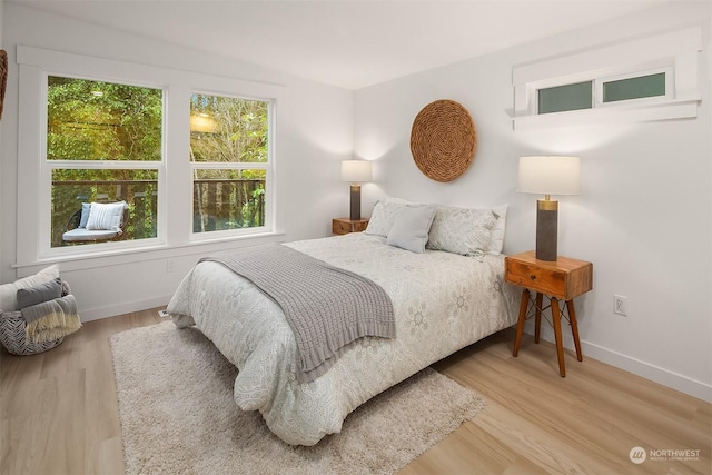 bedroom with hardwood / wood-style flooring