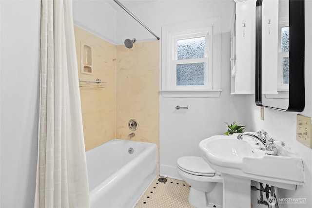 bathroom with tile patterned floors, toilet, and shower / tub combo with curtain