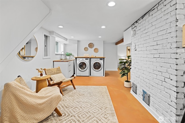 living area featuring recessed lighting, separate washer and dryer, light colored carpet, and brick wall