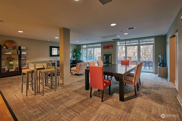 dining room with light colored carpet